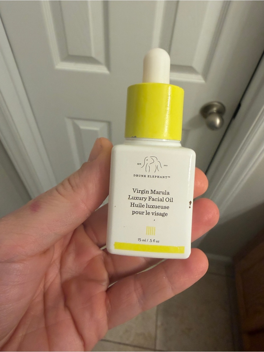 Drunk Elephant Facial Oil Bottle — White & Yellow